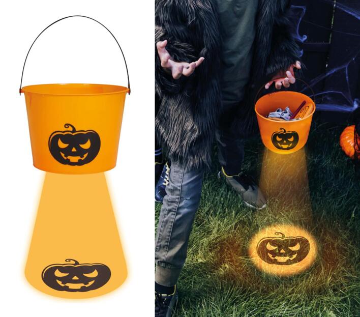 Trick or Treat spand i orange med græskar-lys